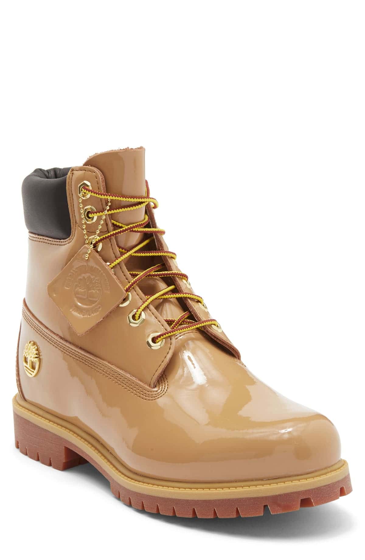 Bota Timberland Premium de 6 pulgadas en charol marrón claro con cuello acolchado oscuro, ojales dorados y cordones rojos y amarillos